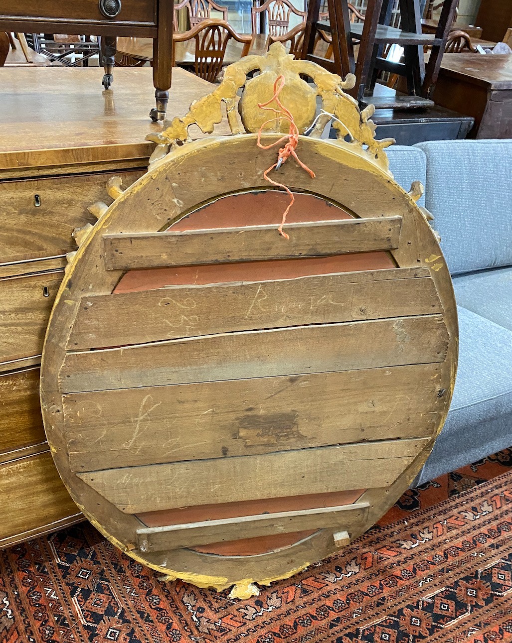 A 19th century French oval giltwood and composition wall mirror, width 80cm, height 119cm.
